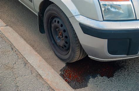 car is leaking red fluid|Leaking bright red from under the car :。